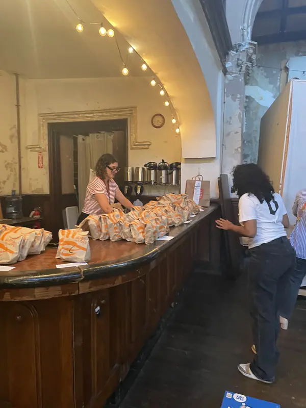 Goody bags for the storytellers lined up along a bar counter before the event.